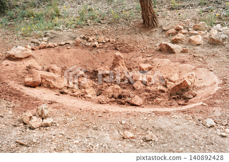 Natural earth circle with rocks in forested area under tree Natural earth circle with rocks in forested area under tree 140892428