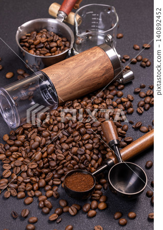 Coffee beans, grinder and ground coffee creating aromatic composition Coffee beans, grinder and ground coffee creating aromatic composition 140892452