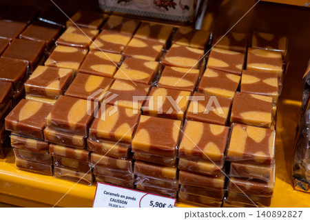 Stack of wrapped caramel and nougat confections on display in french market Stack of wrapped caramel and nougat confections on display in french market 140892827