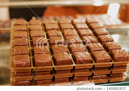 Delicious assortment of gourmet boxed chocolates in a candy shop display Delicious assortment of gourmet boxed chocolates in a candy shop display 140892837