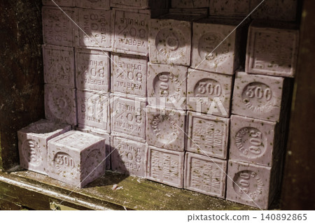 Vintage soap bars stacked in rustic wooden shelf displaying artisan craftsmanship Vintage soap bars stacked in rustic wooden shelf displaying artisan craftsmanship 140892865