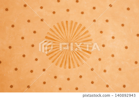 Abstract circular pattern with radiating lines and stars on orange background Abstract circular pattern with radiating lines and stars on orange background 140892943