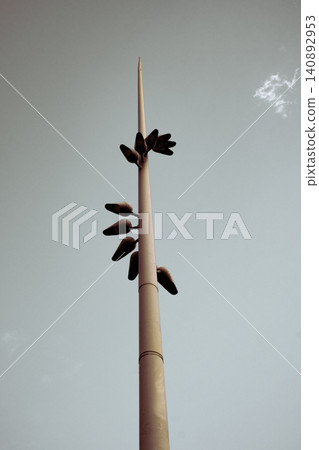 Minimalist architectural light pole against clear sky capturing urban simplicity and modern design Minimalist architectural light pole against clear sky capturing urban simplicity and modern design 140892953