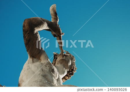 Ancient marble statue against clear blue sky: timeless artistry and sculptural excellence Ancient marble statue against clear blue sky: timeless artistry and sculptural excellence 140893026