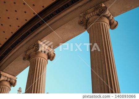 Architectural elegance: classical columns under a clear blue sky 140893066