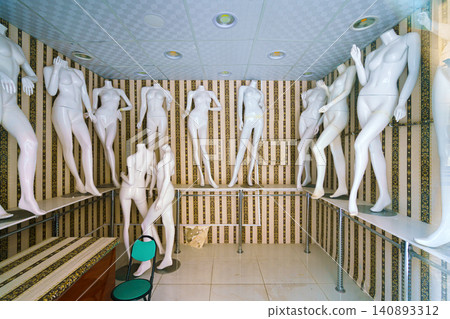 Naked mannequins stand in the interior of an abandoned clothing store, Jeddah, Saudi Arabia 140893312