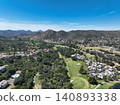 Aerial view of Ramona neighborhood with mountain, valley and golf course 140893338