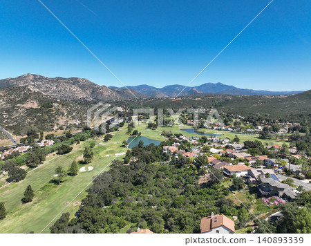 Aerial view of Ramona neighborhood with mountain, valley and golf course Aerial view of Ramona neighborhood with mountain, valley and golf course 140893339