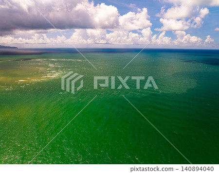 Aerial view of sea surface water texture background,sun reflections Aerial flying drone view Waves water surface texture in sunny day Aerial view of sea surface water texture background,sun reflections Aerial flying drone view Waves water surface texture in sunny day 140894040