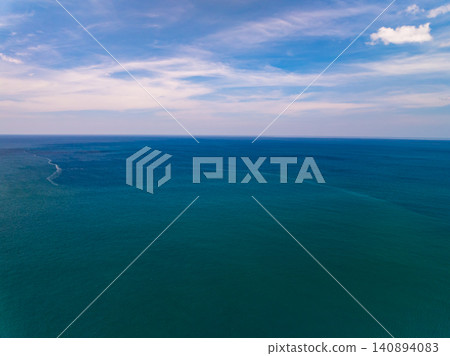 Aerial view of sea surface water texture background,sun reflections Aerial flying drone view Waves water surface texture in sunny day Aerial view of sea surface water texture background,sun reflections Aerial flying drone view Waves water surface texture in sunny day 140894083