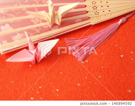 A background adorned with Japanese-style fans and origami cranes. A background adorned with Japanese-style fans and origami cranes. 140894592