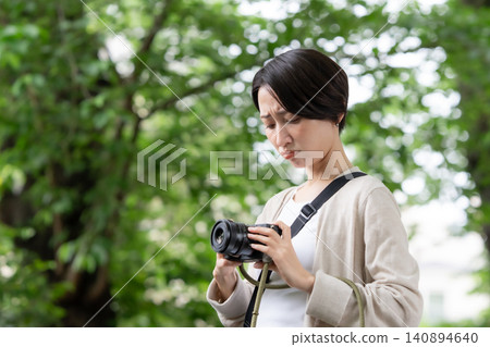 A woman with a camera A woman with a camera 140894640