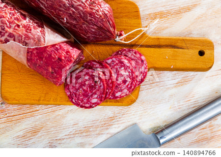 Sliced Iberian dry cured salchichon from pork meat without paprika Sliced Iberian dry cured salchichon from pork meat without paprika 140894766
