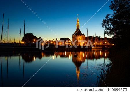 Harbour of Hoorn with sailboats at evening and the Hoofdtoren. Hoorn is harbor town at the Markermeer dating back to the 12th century, Hoorn, Netherlands Harbour of Hoorn with sailboats at evening and the Hoofdtoren. Hoorn is harbor town at the Markermeer dating back to the 12th century, Hoorn, Netherlands 140894875