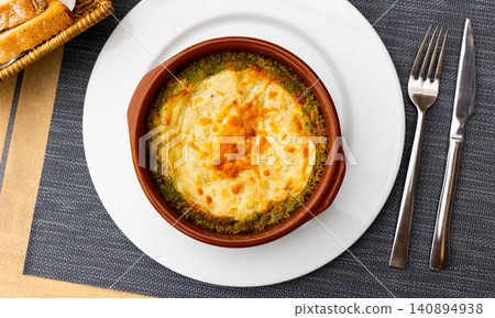 Lasagna with meat and spinach on platter Lasagna with meat and spinach on platter 140894938