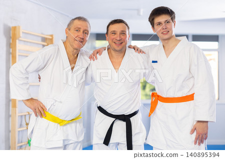 Group of male karatekas posing in studio Group of male karatekas posing in studio 140895394