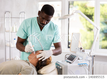 doctor meticulously performs cosmetic procedure 140895515