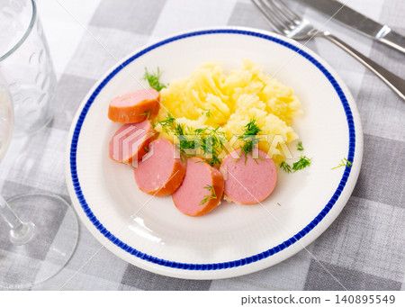 Mashed potatoes with sausage served on platter Mashed potatoes with sausage served on platter 140895549