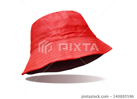 A red bucket hat stands out against a white background. A red bucket hat stands out against a white background. 140895596
