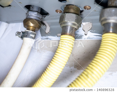 Part of gas equipment. Hoses in a gas water heater. Gas flows through these pipes at home Part of gas equipment. Hoses in a gas water heater. Gas flows through these pipes at home 140896328