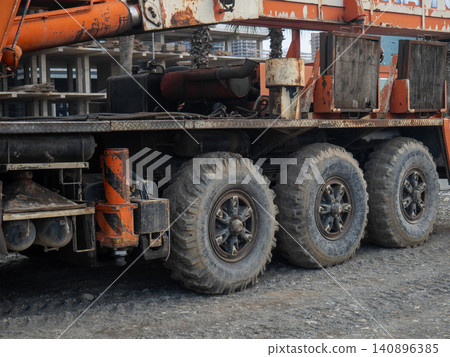 Crane on large wheels. Construction equipment. Non-working hours. Crane on large wheels. Construction equipment. Non-working hours. 140896385