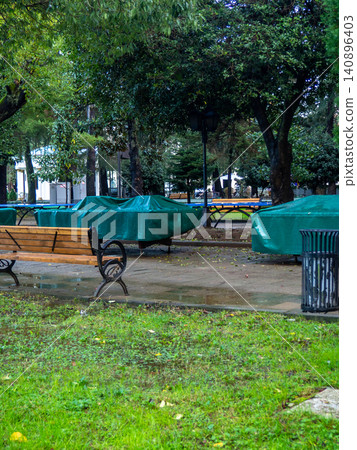 Park after the rain. Park lawn in puddles. After bad weather. Autumn in the park. Park after the rain. Park lawn in puddles. After bad weather. Autumn in the park. 140896403