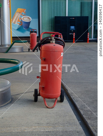 Gas cylinder for refueling cars. Refueling. Gas cylinder in the city. Gas cylinder for refueling cars. Refueling. Gas cylinder in the city. 140896417