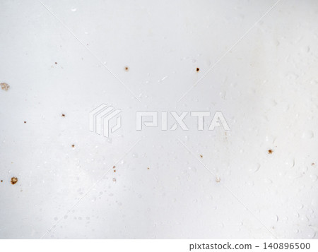Mold on bathroom enamel. Mold spores in the bathroom. Black dots on a white background. A problem for everyday life. The need for a cleaning agent. Mold on bathroom enamel. Mold spores in the bathroom. Black dots on a white background. A problem for everyday life. The need for a cleaning agent. 140896500