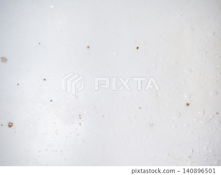 Mold on the enamel in the bathroom. Mold spores in the bathroom. Black dots on a white background. The problem of everyday life. The need for a cleaning product Mold on the enamel in the bathroom. Mold spores in the bathroom. Black dots on a white background. The problem of everyday life. The need for a cleaning product 140896501