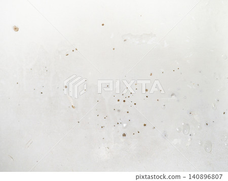 Mold on the surface of the bath. Dark mold close-up on bath enamel. Dirty white surface. Mold on the surface of the bath. Dark mold close-up on bath enamel. Dirty white surface. 140896807