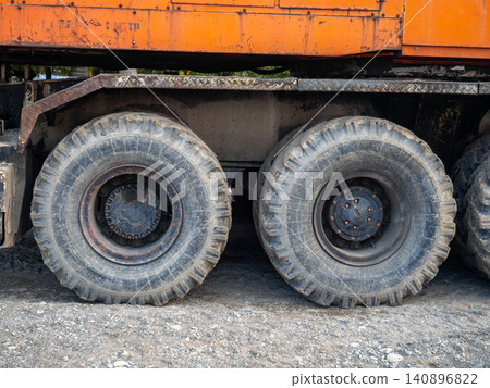 Crane on large wheels. Construction equipment. Non-working hours. Crane on large wheels. Construction equipment. Non-working hours. 140896822