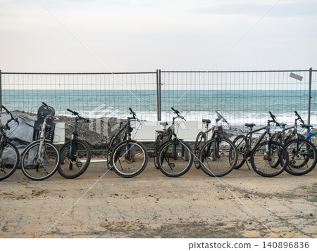 Bicycles for rent are located along the sea. Transport rental at the resort. Business on the beach. not a season . Bicycles for rent are located along the sea. Transport rental at the resort. Business on the beach. not a season . 140896836