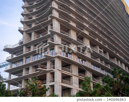 Background of buildings. Modern urban development. Lots of windows. Cement and concrete. Background of buildings. Modern urban development. Lots of windows. Cement and concrete. 140896863