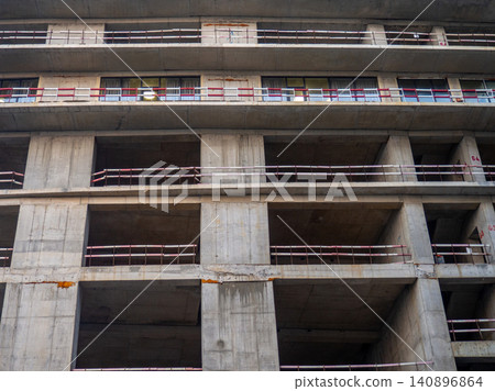 Background of buildings. Modern urban development. Lots of windows. Cement and concrete. Background of buildings. Modern urban development. Lots of windows. Cement and concrete. 140896864