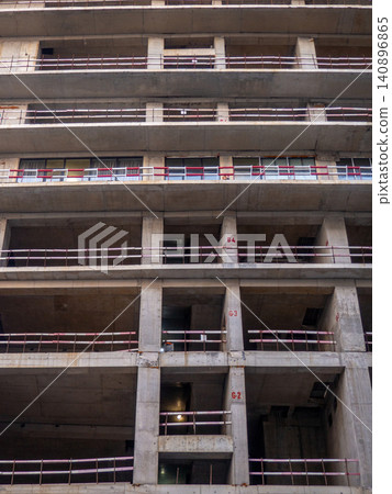 Background of buildings. Modern urban development. Lots of windows. Cement and concrete. Background of buildings. Modern urban development. Lots of windows. Cement and concrete. 140896865