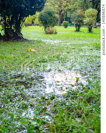 Park after the rain. Park lawn in puddles. After bad weather.  Autumn in the park. 140896874