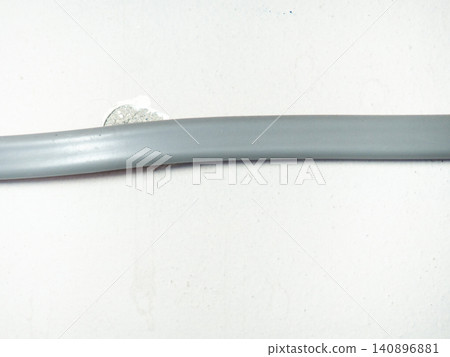 Fastening the wire to the wall. Ceiling mounting. Electric cord in the apartment. 220 volt. Fastening the wire to the wall. Ceiling mounting. Electric cord in the apartment. 220 volt. 140896881