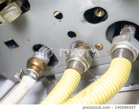 Part of gas equipment. Hoses in a gas water heater. Gas flows through these pipes at home. Part of gas equipment. Hoses in a gas water heater. Gas flows through these pipes at home. 140896897