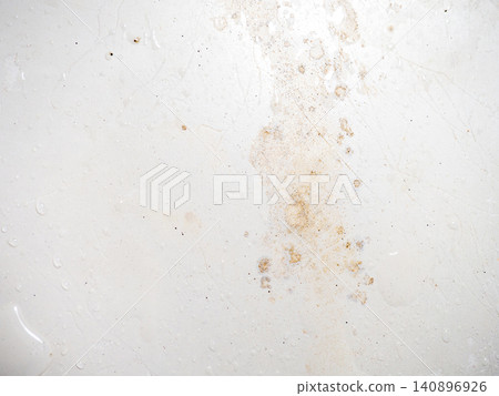 Mold on bathroom enamel. Mold spores in the bathroom. Black dots on a white background. A problem for everyday life. The need for a cleaning agent. Mold on bathroom enamel. Mold spores in the bathroom. Black dots on a white background. A problem for everyday life. The need for a cleaning agent. 140896926