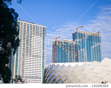 Architecture of a modern city. High-rise buildings and the roof of the stadium. Batumi Stadium. Architecture of a modern city. High-rise buildings and the roof of the stadium. Batumi Stadium. 140896969