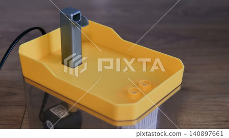 Yellow Cat Drinking Fountain with Flowing Water Yellow Cat Drinking Fountain with Flowing Water 140897661