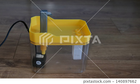 Yellow Cat Drinking Fountain with Flowing Water Yellow Cat Drinking Fountain with Flowing Water 140897662
