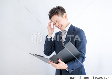 Businessmen who are troubled by documents Businessmen who are troubled by documents 140897678