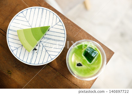 Green tea cake pie with gradient layered in cafe. 140897722