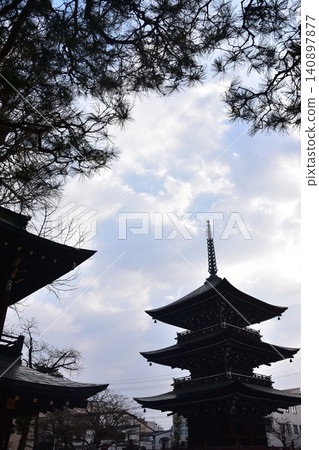 Takayama City, Gifu Prefecture, Japan - Hida Kokubunji Temple's three-story pagoda and surrounding townscape during the Takayama Spring Festival Takayama City, Gifu Prefecture, Japan - Hida Kokubunji Temple's three-story pagoda and surrounding townscape during the Takayama Spring Festival 140897877