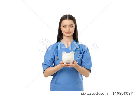 Person in blue scrubs holds a piggy bank, isolated, PNG Person in blue scrubs holds a piggy bank, isolated, PNG 140898087