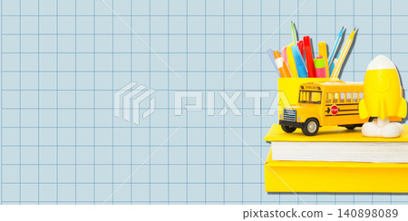 Back to school, Colorful stationery and a toy school bus are neatly displayed for new academic year Back to school, Colorful stationery and a toy school bus are neatly displayed for new academic year 140898089