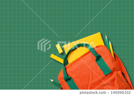 Back to school, Backpack filled with school supplies rests on green grid background Back to school, Backpack filled with school supplies rests on green grid background 140898102