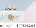 Coffee cup with foam and wooden blocks spelling good morning 140898204
