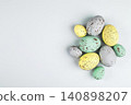 Colorful speckled eggs on light gray background 140898207
